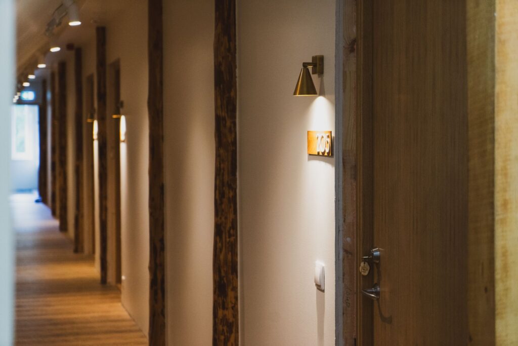 Interior corridor at Mia Glamping hotel in Saaremaa with warm lighting and wooden details