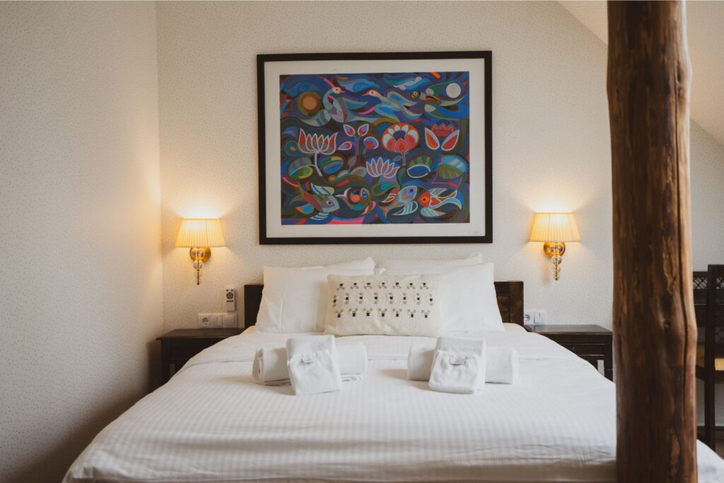 Hotel room at Mia Glamping in Saaremaa with double bed and minimalist interior