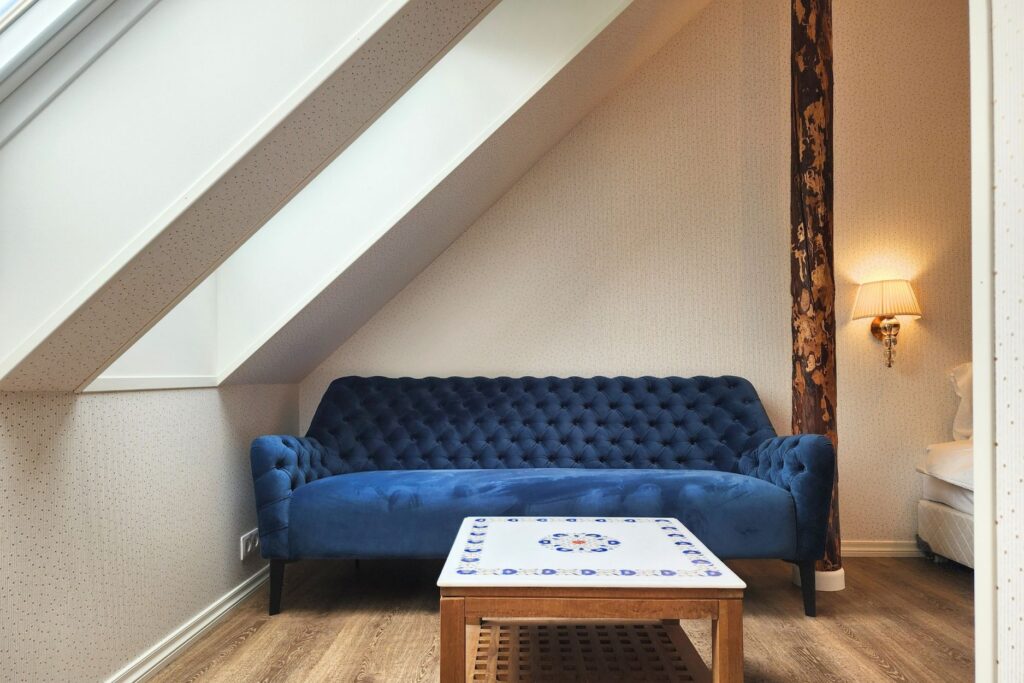 Lounge area in hotel room at Mia Glamping in Saaremaa with sofa and skylight
